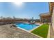 Sparkling pool with patio area, desert landscaping, and space for outdoor enjoyment at 5345 W Leodra Ln, Laveen, AZ 85339