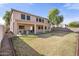 Large backyard with covered patio area, ideal for entertaining or relaxing outdoors at 5422 W Bryce Ln, Glendale, AZ 85301