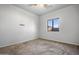 Bedroom featuring neutral carpet and a window with outside view at 5422 W Bryce Ln, Glendale, AZ 85301