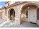 Inviting front entrance showcasing an arched entryway and well-maintained exterior at 5422 W Bryce Ln, Glendale, AZ 85301