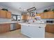 Bright kitchen with stainless steel appliances, center island, and lots of counter space at 5422 W Bryce Ln, Glendale, AZ 85301