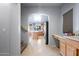 View of kitchen and stainless steel refrigerator, with stairs nearby at 5422 W Bryce Ln, Glendale, AZ 85301