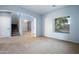 Spacious living room boasts natural light and seamless transitions to the staircase and the foyer at 5422 W Bryce Ln, Glendale, AZ 85301