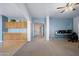 Open-concept living room, dining area with lots of space for office setup and entertaining at 5422 W Bryce Ln, Glendale, AZ 85301