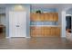 Spacious room with built-in cabinets, great for storage or entertaining at 5422 W Bryce Ln, Glendale, AZ 85301