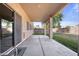 Covered patio with view of large backyard and block wall at 5422 W Bryce Ln, Glendale, AZ 85301