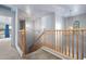 Stairway leading to second level, with natural light and view of the property at 5422 W Bryce Ln, Glendale, AZ 85301