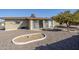 Home exterior showing back patio, gravel yard, and access to sun room via sliding glass door at 5833 E Butte St, Mesa, AZ 85205