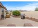 Backyard featuring a built-in barbecue grill and desert landscaping with mountain views at 6353 S Eagle Ct, Gold Canyon, AZ 85118