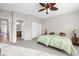 Bright bedroom with neutral walls, a large window, and two beds, with ensuite bathroom at 6353 S Eagle Ct, Gold Canyon, AZ 85118