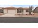 Charming single-story home featuring desert landscaping, a tile roof, and a two-car garage at 6353 S Eagle Ct, Gold Canyon, AZ 85118