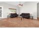 Bright living room filled with natural light showcasing tile flooring and comfortable leather seating at 6353 S Eagle Ct, Gold Canyon, AZ 85118