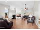 Spacious living room featuring tile floors, neutral walls, and comfortable leather furniture at 6353 S Eagle Ct, Gold Canyon, AZ 85118