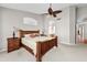 Spacious main bedroom with a ceiling fan, ensuite bathroom, and neutral decor at 6353 S Eagle Ct, Gold Canyon, AZ 85118