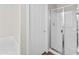 Bathroom shower with white tile, a glass door, and chrome fixtures at 6353 S Eagle Ct, Gold Canyon, AZ 85118