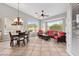 Bright sunroom featuring tile flooring, large windows, and comfortable seating area at 6353 S Eagle Ct, Gold Canyon, AZ 85118