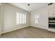 Bright dining room featuring natural light, wood floors, and a stylish chandelier at 6625 E Villa Rita Dr, Phoenix, AZ 85054