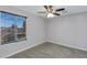 Neutral bedroom featuring a window with blinds and a ceiling fan at 681 E Los Arboles Pl, Chandler, AZ 85225