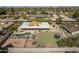 An aerial view of a home with a pool, landscaped backyard, and outdoor entertainment area at 7545 W Villa Rita Dr, Glendale, AZ 85308