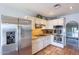 Well-equipped kitchen with stainless steel refrigerator, modern appliances, and ample cabinet space at 7545 W Villa Rita Dr, Glendale, AZ 85308