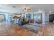 Bright living room featuring terracotta tile, an open layout, and abundant natural light at 7545 W Villa Rita Dr, Glendale, AZ 85308