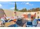 A cozy backyard patio features outdoor seating, grill and built-in cushions at 8736 W Kathleen Rd, Peoria, AZ 85382