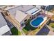Aerial view highlights a backyard featuring a pristine pool, covered patio, and well-maintained landscaping for relaxation at 8736 W Kathleen Rd, Peoria, AZ 85382