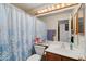 Bathroom vanity featuring a large mirror, vanity lights, and framed mirror at 8736 W Kathleen Rd, Peoria, AZ 85382