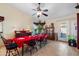 Dining room with tile flooring and large windows with an elegant dining table for Gathering meals and entertaining guests at 8736 W Kathleen Rd, Peoria, AZ 85382