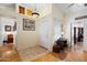 Bright foyer with hardwood flooring, decorative accents, and high ceilings, offering an inviting entrance to the home at 8736 W Kathleen Rd, Peoria, AZ 85382