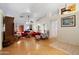 Spacious living room with hardwood floors, neutral walls, and a layout that is great for Gathering gatherings and activities at 8736 W Kathleen Rd, Peoria, AZ 85382