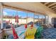 Enclosed patio with colorful table, chairs, overhead lights and view of backyard at 8736 W Kathleen Rd, Peoria, AZ 85382