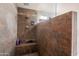 Close-up of a tile shower with built-in niche and modern fixtures at 8736 W Kathleen Rd, Peoria, AZ 85382