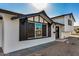 Beautiful front exterior of a home with modern black and white accents at 8743 E Rose Ln, Scottsdale, AZ 85250