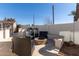 Inviting outdoor kitchen with built in barbecue, stylish seating area, and fire pit at 901 E Scott Ave, Gilbert, AZ 85234