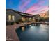Aerial view of a backyard showcasing a sparkling pool, landscaping, and inviting outdoor space at 9412 E Hidden Spur Trl, Scottsdale, AZ 85255