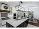 Bright kitchen with marble countertops, stainless appliances, and dining area with elegant chandelier at 9412 E Hidden Spur Trl, Scottsdale, AZ 85255