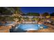 A stunning pool with water features and lush landscaping, creating a serene and private backyard oasis at 9412 E Hidden Spur Trl, Scottsdale, AZ 85255