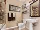 Cozy bathroom with a tiled shower, pedestal sink, and decor at 1 E Lexington Ave # 1210, Phoenix, AZ 85012