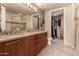 Elegant bathroom features dual vanities, a walk-in shower, and a walk-in closet at 1 E Lexington Ave # 1210, Phoenix, AZ 85012