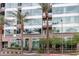 Modern building exterior with palm trees and street view at 1 E Lexington Ave # 1210, Phoenix, AZ 85012