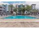 A sparkling pool with lounge chairs and modern residential backdrop at 1 E Lexington Ave # 1210, Phoenix, AZ 85012