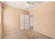 Cozy bedroom with plush carpeting, featuring closet doors and ample natural light from the window at 10352 E Second Water Trl, Gold Canyon, AZ 85118