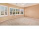 Serene main bedroom featuring plush carpeting, a ceiling fan, and natural light from the window with shutter blinds at 10352 E Second Water Trl, Gold Canyon, AZ 85118