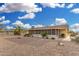 Charming home exterior with a screened patio and low-maintenance desert landscaping at 10414 W Ponderosa Cir, Sun City, AZ 85373