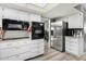 Well-lit kitchen featuring stainless steel appliances and modern white cabinetry at 10414 W Ponderosa Cir, Sun City, AZ 85373