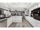 Bright, open kitchen featuring white cabinets, granite countertops and stainless appliances at 10414 W Ponderosa Cir, Sun City, AZ 85373