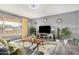 Stylish living room featuring modern decor, ample natural light, and sleek flooring at 10414 W Ponderosa Cir, Sun City, AZ 85373