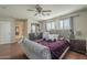 Charming bedroom featuring hardwood floors and large windows at 10423 W Hughes Dr, Tolleson, AZ 85353