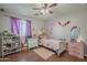 A bedroom that is decorated with colorful patterns and accents at 10423 W Hughes Dr, Tolleson, AZ 85353